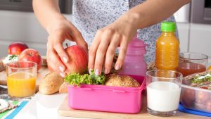 Young woman making school lunch in the morning; Shutterstock ID 169469576; PO: today.com